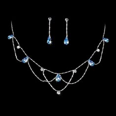 Blue Teardrop Crystal Wedding Jewelry SetAdd vintage elegance to your special day with this beautiful silver plated necklace and earring set. Clear round and blue teardrop crystal rhinestones are interspersed in a charming vintage inspired design. This jewelry set would be perfect for the bride or her bridesmaids or for prom.Size: The necklace is  15 1/2" long with a 3 1/2" extender. The pierced earrings are 1 1/4" long.Color: Silver/Blue.Style: ne8000bl.Do you need several jewelry sets for your Prom Jewelry Sets, Light Blue Necklace, Blue Jewelry Set, Rhinestone Jewelry Set, Crystal Wedding Jewelry, Magical Jewelry, Prom Jewelry, Bridesmaid Jewelry Sets, Fancy Jewelry