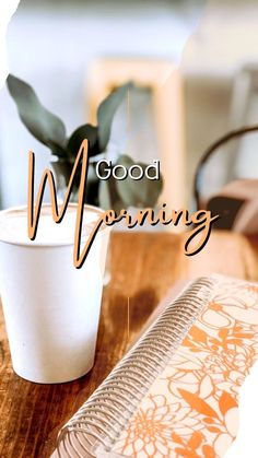 a coffee cup sitting on top of a wooden table