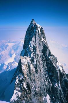 the top of a mountain with snow on it