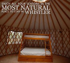 the inside of a yurt with a bunk bed in it