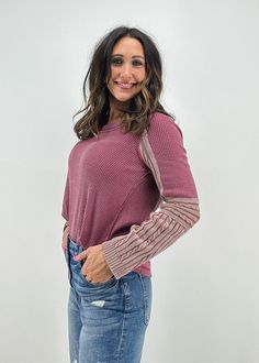 Look effortlessly chic in this cozy top by Free People. With purple hues and woven cuffed sleeves, this top is sure to be a favorite! Also available in grey! Pink Textured Knit Tops For Layering, Chic Tops For Layering With Ribbed Cuffs, Casual Tops With Cuffed Sleeves For Fall, Mauve Long Sleeve Tops For Winter, Trendy Heather Long Sleeve Tops, Chic Mauve Tops For Fall, Mauve Long Sleeve Tops For Fall, Long Sleeve Mauve Tops For Fall, Trendy Heather Tops For Fall