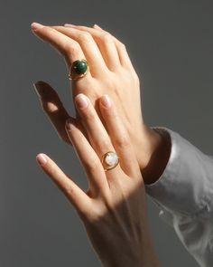 Enviable with its handmade craft the Neon ring features repurposed gold for sustainable shine. The green malachite stone highlights your finger with its cabochon cut. This piece is made to order just for you so please allow 3-6 weeks for your item to ship. This item is final sale. 9k gold (ring) 14k gold (setting) and malachite cabochon Gold: repurposed Clean with soft cloth Stone sourced from India Handmade in Antwerpen Belgium | Nayestones Neon Malachite Ring 8 | Gemstones/Yellow Gold Modern Yellow Gold Cabochon Rings, Modern Round Emerald Ring For Formal Occasions, Modern Formal Emerald Cabochon Ring, Modern Cabochon Emerald Ring For Formal Occasions, Elegant Yellow Gold Rings With Natural Stones, Elegant Yellow Gold Ring With Natural Stones, Formal Emerald Open Ring, Luxury Emerald Rings With Polished Finish, Modern Polished Emerald Ring Gift