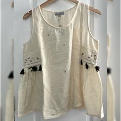 New With Tags! Linen Top Tassel, Embroidered Detail Truly Fits More Of A Medium Boho Beach Chic Style, Perfect For Summer Smoke Free Home Beige Cotton Tops With Embroidered Hem, Embroidered Beige Tops For Vacation, Casual Cream Cotton Embroidered Top, Beige Cotton Top With Floral Embroidery, Cream Embroidered Tops For Vacation, Casual Cream Embroidered Tops, Beige Floral Embroidered Cotton Tops, Bohemian Embroidered Tank Top For Vacation, Cream Embroidered Cotton Tops