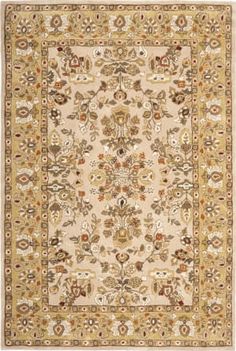 a beige and gold rug with an ornate design on the center, surrounded by flowers