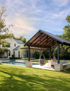 a large backyard with a pool and hot tub