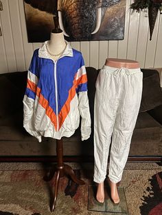 Longstreet Missy~ Vintage Retro Women's Size Large Tracksuit. This set includes windbreaker jacket & sweatpants. This outfit is in MINT condition with NO tears or stains!!  Jacket Details: 1.) Breast~ 44" inches  2.) Shoulder to hem: 25" in  3.) Sleeve Length~32" in. (Average size)  4.) Shoulder to shoulder~ 15" inches  5.) No shoulder pads & 6.) NO hood 7.) Zipper front for closure  8.) 2 front pockets  9.) Waist~ 42" in . 10.) Shell: 100% Nylon; Lining: 65% Polyester  & 35% Cotton 11.) Made in White Spring Sports Tracksuit, White Spring Tracksuit For Sports, White Tracksuit For Sports In Spring, White Tracksuit With Pockets For Sports, White Sporty Tracksuit For Spring, White Sporty Tracksuit With Pockets, Sporty White Tracksuit With Pockets, Womens Sports, Retro Women