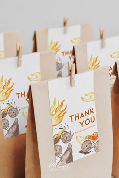 brown paper bags with thank you tags attached to them