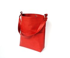 Red hobo bag faux leather handmade.  Height - 32 cm  (12,59 ") Top width from seam to seam - 33 cm  (12,99 ") Bottom width - 23 cm ( 9,06 " ) Depth - 10 cm   (3,93 ") Handle - 56 cm  (22,04 ") Red orange brick color hobo bag is made of faux leather. Red orange bag has a cotton lining, 1 large pocket outside, 2 pockets inside. Hobo bag is very beautiful and stylish. Dark orange (red brick) color is very popular. Fashion red shoulder bag for women fastens with magnetic button. Women's red orange h Red Faux Leather Office Bag, Red Rectangular Faux Leather Bag, Red Faux Leather Shoulder Bag With Double Handle, Red Rectangular Hobo Bag With Large Capacity, Large Capacity Red Rectangular Hobo Bag, Everyday Red Faux Leather Satchel, Red Square Shoulder Bag For Errands, Red Bucket Satchel With Large Capacity, Square Red Hobo Bag For Daily Use