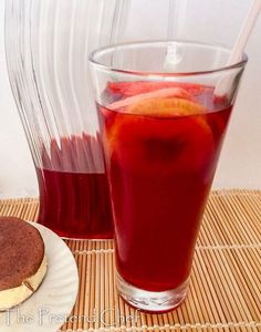 there is a plate with some fruit on it next to a drink