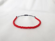 RED Beaded Minimal Cord Bracelet * Size 6-7 Inches * Opaque Red Bead Bracelet * Red Seed Bead Bracelet * RED String Bracelet * Red Bracelet This is a minimal bracelet, A lightweight & delicate bracelet and perfect for everyday wear.  Perfect as Birthday, Christmas and Friendship presents. The bracelet will fit wrist size 6 to 7 inches. Please note this bracelet is not sterling silver.  If you have any questions about the bracelet, contact me through the "Etsy conversation system". PLEASE NOTE: C Red Adjustable Friendship Bracelets With Tiny Beads, Adjustable Red Friendship Bracelets With Tiny Beads, Adjustable Red Friendship Bracelets With Colorful Beads, Red Beaded Friendship Bracelets For Beach, Adjustable Red Friendship Bracelets With Spacer Beads, Red Beaded Bracelets With Spacer Beads For Beach, Adjustable Red Friendship Bracelets, Red Beaded Friendship Bracelets, Red Beaded Bracelets For The Beach