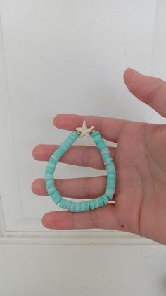 a seafoam colored bracelet with little gold beads and a starfish charm!! 🌊 Turquoise Starfish Beaded Bracelets, Ocean-inspired, Ocean-inspired Turquoise Starfish Beaded Bracelets, Turquoise Ocean-inspired Bracelet With Starfish Charm, Ocean-inspired Turquoise Bracelet With Starfish Charm, Turquoise Beaded Bracelets With Starfish Charm, Turquoise Starfish Charm Bracelets For Beach, Turquoise Bracelets With Starfish Charm For Beach, Turquoise Strand Bracelet With Starfish Charm, Turquoise Bracelet With Starfish Charm For Vacation