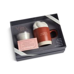 Boxed gift set, ready to give, beautifully packaged with sentimentMoment of Comfort gift set includes mug with debossed sentiment, cozy socks, and jar candleA Moment of Comfort, in shades of coral and ivory; Mug holds 14 ounces, is safe for mw/dwSocks - one size fits most adults, washableCashmere aroma candle burns for 20 hours, a warm scent of golden amber, vanilla, musk and cedarwood.Box with lid includes sentiment insert cardA gift you can send directly to the recipientInhale. Exhale. RepeatB Candle Gift Box, Comfort Gifts, Aroma Candle, Happy Gifts, Small Candles, Hand Crafted Gifts, Sock Gifts, Candle Set, Candle Gift