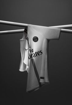 a white shirt hanging from a clothes line with the word vivigates on it