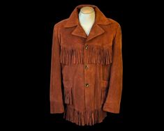 1970's RUST SUEDE FRINGE JACKET Absolutely Amazing Vintage Fringe Coat in Rich Rust Brown with warm Sherpa Lining. Suede Fringe across Chest/Back, Pockets and Hem is in Mint Condition. 3 Button close with 2 Hip Pockets. Quilted acetate lining in both Sleeves, body of Jacket is lined in Sherpa. BY: Sears Western Wear SIZE: marked Large and Tall but will fit like an XL or even XXL, see measurements to determine Fit. FABRIC: exterior is Cow rawhide, interior is faux Sherpa CONDITION: Mint. Appears 1970s Long Sleeve Outerwear For Fall, 1970s Long Sleeve Fall Outerwear, 1970s Style Fall Outerwear With Pockets, Fringe Coats, Vintage Fringe, Sherpa Coat, Suede Fringe Jacket, Fringe Jacket, Suede Fringe