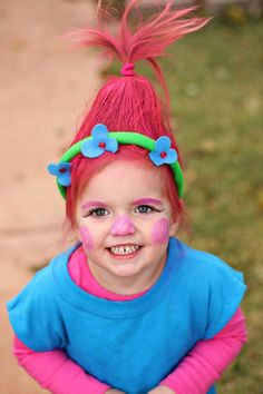 Princess Poppy. Trolls. DIY Halloween. Face paint I used regular face paint in the craft section. The Halloween makeup didn't work. There's a toliet paper roll/tube in her hair to help keep the shape. I sprayed her hair with hairspray first then used the Wal-Mart Halloween hair color spray. It dried quick and washed out easy. Diy Halloween Face Paint, Diy Halloween Face, Hair Spray Paint, Troll Hair Diy, Halloween Face Paint, Troll Costume, Poppy Trolls, Hair Color Spray, Princess Poppy