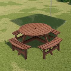 a picnic table and benches in the grass