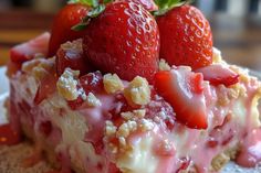 a piece of cake with strawberries on top