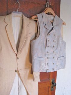 "Note: We can make all types of frock coats and vests. Just contact us if you have a different style in mind. ------------------------------------------------------------ This listing is for a 3-Piece suit with an Edwardian style frock coat, made from a genuine vintage pattern. The jacket and the pants are made from a wheat colored linen and the double breasted vest is made from a stunning brocade. The frock coat is a gently cut-away front morning coat with two buttons and longer narrow lapels. Elegant Cotton Nehru Jacket For Spring, Fitted Vest With Buttons For Wedding, Fitted Wedding Vest With Buttons, Elegant Fitted Vest With Pockets, Fitted Spring Suit With Vest, Fall Costume Vest Fitted, Fitted Cotton Nehru Jacket For Fall, Elegant Cotton Nehru Jacket For Formal Occasions, Sleeveless Vest With Buttons For Wedding