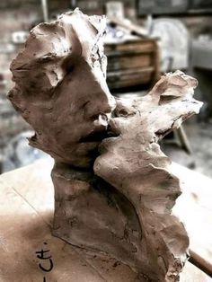 a close up of a clay sculpture on a table