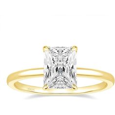 a princess cut diamond engagement ring in yellow gold