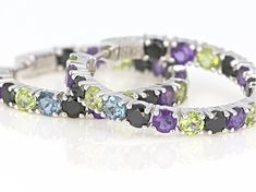 .54ctw round London blue topaz, 2.13ctw round African amethyst, 2.30ctw round Manchurian Peridot™ and 3.26ctw round black spinel, sterling silver inside/outside hoop earrings. Measure approximately 1.29"L x .16"W. Latch back closures. Luxury Hoop Multi-stone Jewelry, Luxury Multi-stone Hoop Jewelry, Round Multi-stone Cubic Zirconia Gemstones, Multicolor Round Gemstones With Prong Setting, White Gold Round Multi-stone Gemstones, Fine Jewelry Cubic Zirconia Round Gemstones, Round Cubic Zirconia Fine Jewelry Gemstones, Fine Jewelry Cubic Zirconia Gemstones, Elegant Multi-stone Hoop Jewelry