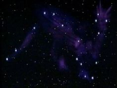 an image of the night sky with stars and bright purple light in it's center