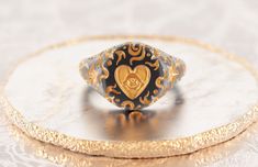 Meaningful signet for her, which translates wish making and life. Black and gold design, silky satin finish with warm golden details -925 Silver -Black rhodium&gold plating -Weight~7 gm Please allow up to 2-3 weeks for production, as each item is made to order. Black And Gold Design, Dark Grey Background, Ring Heart, Jewelry Aesthetic, Signet Rings, Black Rhodium, Pinky Ring, Gold Design, Signet Ring