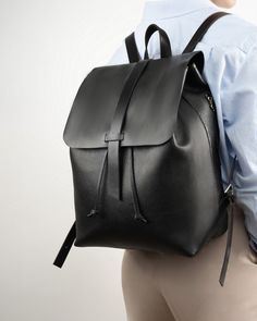 "The black handmade leather backpack will fit everything you need for everyday commuting. The leather backpack is available in the size to fit your laptop. This backpack is made with black straps. Makes a cute gift for her. 🔶FEATURES🔶 ✔ Made of soft buttery pebbled leather ✔Size on the main photo is  L size (L: 10.4\" x H 14.5\" x D: 6\" (26.5 x 37 x 15 cm)) ✔ Available in 3 different sizes ✔Adjustable straps ✔ Durable drawstring 🔶SIZES:🔶 ✅ S - will fit your 11\" and IPad (L: 10.6\" x H: 10.2\" x D:6\" (26 x 27 x 15 cm). It can be made with or without lining. The one with the lining has 4 open pockets and 1 zipped pocket. The lining is waterproof ✅ L - will fit 13\" laptop (L: 10.4\" x H: 14.5\" x D: 6\" (26.5 x 37 x 15 cm)). Lined interior (1 large padded pocket for a laptop and 4 ope Everyday Leather Backpack With Smooth Grain, Daily Use Leather Backpack With Smooth Grain, Tech Organizer, Leather Backpack Women, Handmade Leather Backpack, Cute Gifts For Her, Leather Backpacks, Work Study, Women Leather Backpack