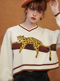 A knit sweatshirt depicting a leopard climbing atop a large, overhanging tree. A leopard looks at me with a melancholy expression. Are they looking for prey, or are they resting for a while before hunting? You will be captivated by its beautiful dynamism and mysterious presence. 
 
 
 Size 
 
 
 FREE size 
 
 
 Length: 43cm 
 Shoulder width: 60cm 
 Bust: 124cm 
 Sleeve length: 46cm 
 
 
 
 
 Material 
 
 viscose 
 Polyester 
 
 
 
 
 
 Model worn 
 
 
 Wearing size 
 
 FREE size 
 
 Model dimens The 90s Fashion, Comfy Casual Outfits, Harajuku Outfits, Leopard Top, Leopard Print Sweater, 2 Piece Skirt Set, Asymmetrical Skirt, Tomboy Fashion, Knit Sweatshirt