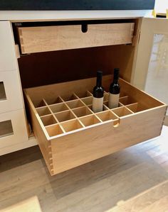 an open drawer with two bottles in it