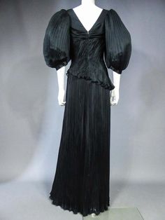 For Sale on 1stdibs - Circa 1985-1990 Paris Haute Couture Beautiful long evening dress in black silk crepe by Emanuel Ungaro Haute Couture numbered 295-5-85 around 1985/1990. Pleated Pre-draped Evening Dress, Pleated Silk Evening Dress, Black Pre-draped Evening Dress With Pleated Bodice, Black Silk Evening Dress With Pleated Bodice, Vintage Black Evening Dress For Gala, Vintage Black Floor-length Evening Dress, Vintage Silk Evening Dress, Paris Haute Couture, Long Evening Dress