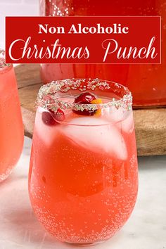 two glasses filled with christmas punch on top of a table