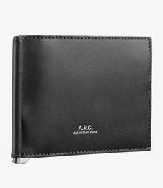 A.P.C. Men's money clip wallet.- Smooth vegetable-tanned leather.- Three card slots.- One slot closed by a silver zip.- A silver money clip.- A.P.C. logo embossed in silver. Silver Money Clip, Faux Leather Bag, Exclusive Clothing, C Logo, Clip Wallet, Backpack Tote Bag, Money Clip Wallet, Scarf Jewelry, Tote Backpack