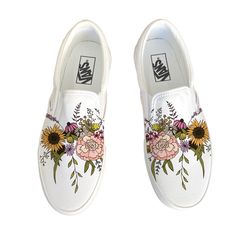 Wildflower Vans Slip Ons have been customized with a wildflower bouquet.  These Vans shoes have canvas uppers.  Vulcanized waffle rubber outsoles. For Men and Women.  We source each pair of shoes brand new directly from Vans.  The ink is permanent and will never come off. Made in the USA. This price includes everything: shoes, artwork, and shipping. Thanks for stopping by our Etsy shop! Please message us with any questions! Sizes listed are in US sizing scale. If you have any issues with your order, please feel free to reach out to us and we will be more than glad to help you! Note: Blvd Custom is in no way affiliated with any of the shoe brands or companies that are featured on our website. Each pair of shoes is ordered lawfully bought at retail price. White Custom Sneakers With Gum Sole For Spring, Spring Custom Sneakers With Gum Sole And Round Toe, Spring Slip-on Custom Sneakers With Vulcanized Sole, White Floral Print Canvas Shoes For Spring, Hand Painted Slip-on Sneakers For Spring, Spring Canvas Custom Sneakers With Round Toe, Hand Painted White Canvas Sneakers, Spring Canvas Custom Sneakers With Rubber Sole, Spring Custom Sneakers With White Sole