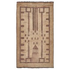 an old rug with geometric design on the front and back side, in brown tones