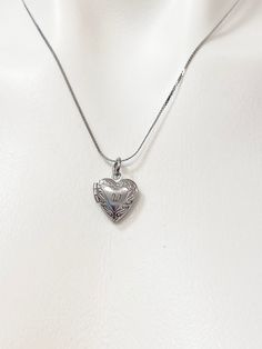 This is a unique engraving initial on stainless steel or brass heart locket charm on 18 inches stainless steel necklace chain. HOW TO ORDER 1) Select the quantity 2) Select the initial and finish 3) Add to cart DESCRIPTION ♥ Necklace, Stainless Stee Chain with Lobster Claw Clasp, Size: about 17.7 inches (45cm) long, 1-2mm wide, Nickel Safe, ♥ Stainless Steel Locket Pendants, Heart, Stainless Steel Color, Size: Size: about 13mm wide, 15mm long, 4.5mm thick, 8x7mm inner *THIS LOCEKET VERY SMALL NOT FOR PHOTO* ♥ Gold Locket Finish, Real 18K Gold Plated over Brass Locket Pendants, Long-Lasting Plated, Heart, Size: about 13mm wide, 15mm long, 4.5mm thick, 8x7mm inner *TINY* ♥ Materials from the USA and international sourcing, Made and ship from Gowen, Michigan. GIFT READY: ♥ Invoice will be sen Engraved Medallion Heart Necklace For Valentine's Day, Engraved Open Heart Locket Necklace, Silver Engraved Initial Pendant Heart Necklace, Heart-shaped Nickel-free Locket Necklace For Memorial, Nickel-free Heart Locket Necklace For Memorial, Engraved Open Heart Locket Necklace For Mother's Day, Memorial Heart-shaped Nickel-free Locket Necklace, Classic Engraved Open Heart Necklace, Engraved Heart Stainless Steel Charm Necklace