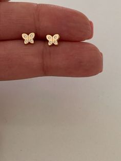 "14k Gold Butterfly Earrings, Cubic Zirconia Dainty Gold Butterfly Stud, Butterflies, Earrings, Tiny Earrings, Studs, Minimal Earrings, 6x5MM ♦ Materials: 14K Gold and Cubic Zirconia ♦ Available colors: Yellow Gold  ♦ Closure: Screw Backs ♦ Earrings Measurements: 6x5 (HxW) Millimeters, these earrings dainty, delicate and beautiful  ----------------------------------------------------------------------------------------------- US Size Guide: These are the sizes of U.S coins to compare with: Dime: 14k Gold Butterfly Earrings For Anniversary, 14k Gold Butterfly Earrings For Gift, Pierced Butterfly Jewelry For Anniversary, Butterfly-shaped Yellow Gold Earrings For Anniversary, Yellow Gold Butterfly Earrings For Anniversary, Butterfly-shaped Yellow Gold Anniversary Earrings, Butterfly Shaped Jewelry With Matching Earrings For Anniversary, Cute Gold Earrings For Mother's Day, Butterfly-shaped Jewelry With Matching Earrings For Anniversary