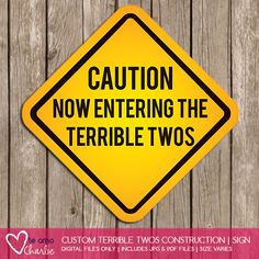 a yellow caution sign that says caution now entering the terrible two's on it