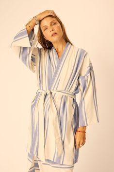 5Short robe with a drop shoulder and full sleeves.Features two oversized pockets.Side slits hit mid-thigh. Styled with the Sarong. -----INTENDED FIT XS fits most 0-2 | S fits most 4-6 | M fits most 8-10 | L fits most 10-14 Model is 5’10” and is wearing a size Small. MATERIAL 50% Rayon & 50% Linen *This garment has been hand dyed and sewn by artisans in Bali.Minor flaws and slight variations in the color and fabric are a natural result of the intensive handmade process.We cherish these imperfecti Oversized Pockets, French Stripes, Full Sleeves, Sarong, Unique Charms, Full Sleeve, Blue Stripes, Drop Shoulder, Hand Dyeing