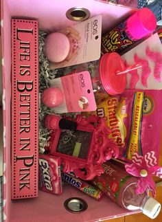 a pink box filled with lots of different items