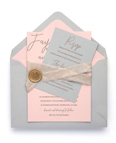 a pink and gray wedding card with a wax seal