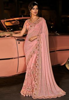 Pink silk festival wear saree 6002  Desc:  Color : Pink Fabric : Silk Wash Care : Dry clean Sleeve Style : Short Sleeve Long Sleeves : Done only in Custom Stitch Sleeves Lining : Done only in Custom Stitch Bust Size : 32 to 42 Inches Occasion : Festival   Kitty Party   Sangeet   Party Wear   Engagement   Reception   Ceremonial. With Express Free Shipping and Custom Stitching, Buy Indian Wedding Party Wear Saree Pink silk festival wear saree 6002 online in USA, UK and Canada from KollyBollyEthnic Sari India, Bollywood Designer Sarees, Pleated Saree, Reception Saree, Indian Designer Sarees, Dress Peach, Heavy Work, Party Wear Saree, Party Kleidung