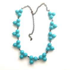 Bright turquoise with a green-hue beads shine in this hand-wired necklace. This style is known as the Tricot Necklace & features hand-linked trefoil, rosary-chain style beads. Measures approximately 24" and adjusts down to 16". A great add-on to these necklaces is the new Leetie Chain Extender Kit. Add loads of variation in the available lengths to these great collectible pieces. Made with lucite from 1960's deadstock, from a warehouse that closed in the early 1980's alongside reproduction l Adjustable Blue Beaded Turquoise Necklace, Blue Turquoise Necklace With Adjustable Chain, Adjustable Green Beaded Chain Turquoise Necklace, Adjustable Wire Wrapped Turquoise Necklace With Round Beads, Blue Turquoise Wire Wrapped Necklace With Round Beads, Blue Turquoise Necklace With Wire Wrapped Round Beads, Blue Wire Wrapped Necklaces With Round Beads, Trinity Necklace, Bright Turquoise