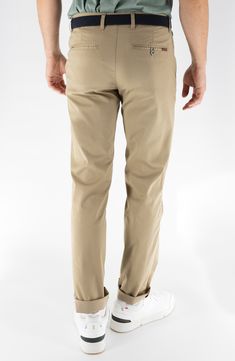 Look sharp and be ready for anything in performance-stretch twill pants sporting slim-cut straight legs and a secure zip pocket at the flat-front waist. 15" leg opening; 10 1/2" front rise Zip fly with button closure Front slant pockets; front zip pocket; back welt pockets 81% cotton, 10% rayon, 7% lyocell, 2% spandex Machine wash, tumble dry Imported Khaki Chino Cotton Twill Straight Leg Bottoms, Khaki Chino Cotton Twill Straight Pants, Khaki Chino Pants With Tapered Leg, Khaki Tapered Leg Chino Pants, Khaki Tapered Leg Chinos For Business Casual, Khaki Straight Leg Chinos For Business Casual, Khaki Straight Leg Chino Pants, Devil Dogs, Fabric Technology