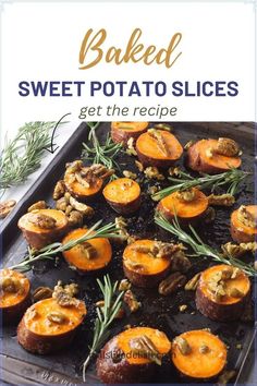 baked sweet potato slices on a baking sheet with rosemary sprigs