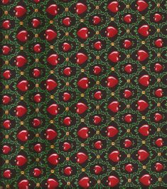 an apple pattern is shown in red and green on a black background with gold accents