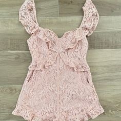 Pretty In Pink In This Blush Lace Romper. The Ruffle Details Are So Gorgeous Throughout. Brand New With Tags Size 4 Retail $118 Pink Flirty Jumpsuits And Rompers For Brunch, Feminine Spring Jumpsuits And Rompers For Date Night, Pink Ruffled Jumpsuits And Rompers For Date Night, Chic Pink Ruffled Jumpsuits And Rompers, Chic Pink Jumpsuits And Rompers With Ruffles, Feminine Pink Jumpsuits And Rompers For Night Out, Applique Jumpsuit, Hot Pink Jumpsuits, Flowy Romper