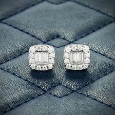 Exclusive 10MM Baguette Moissanite Stud Earrings 14K are now available, made of 925 sterling silver and PVD plated with 14K Gold. Both of these earrings measure exactly 10.45 millimeters in diameter and weigh exactly 2.9 grams each, with an estimated total diamond weight of 0.98 CTW. These men's moissanite earrings are iced out with round and emerald cut, colorless (D-Color), VVS moissanite flawless diamonds, placed in a pave and halo diamond setting. These stud earrings are made with a highly-d Luxury Diamond Earrings With Baguette Cut Halo Design, Baguette Diamond Earrings Fine Jewelry, Diamond Baguette Earrings For Weddings, Anniversary White Gold Baguette Diamond Earrings, Anniversary Diamond Earrings With Baguette Diamonds, Timeless Diamond Accent Baguette Cut Earrings, Silver Emerald Cut Diamond Earrings With Baguettes, Diamond Earrings With Baguette Cut And Baguette Diamonds, Diamond White Baguette Cut Halo Earrings