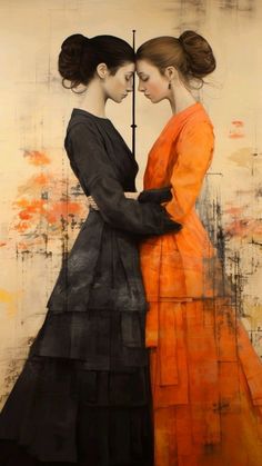 two women in orange and black are facing each other