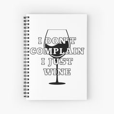 a spiral notebook with the words i don't complain just wine on it